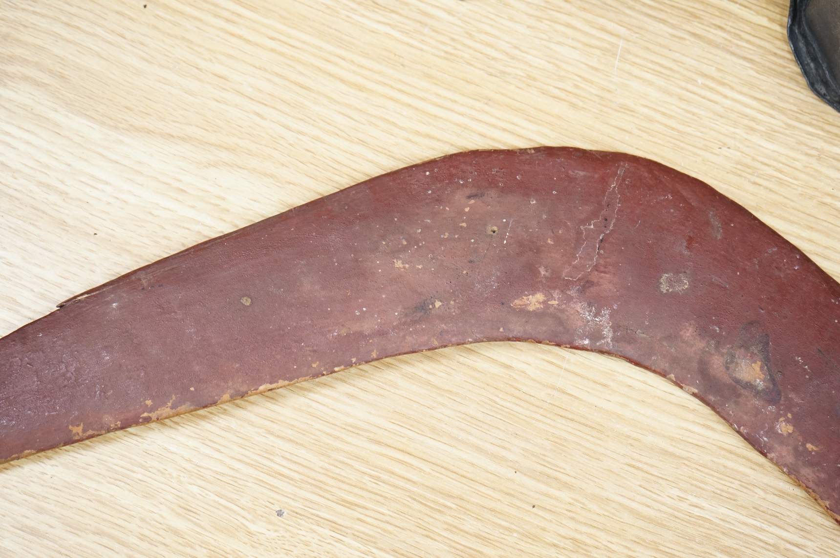 An Australian aboriginal boomerang, 56cm wide, collected in Australia c.1945